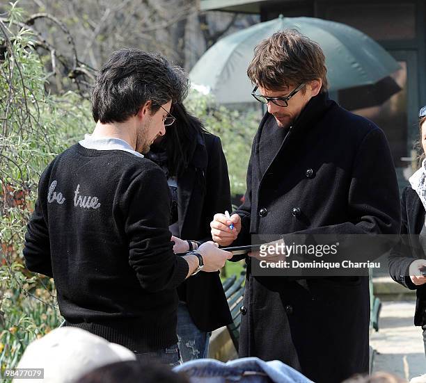 Actor Ethan Hawke signs autographs on location for 'The Woman in the Fifth' in Paris on April 15, 2010 in Paris, France.