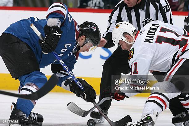 Kevin Porter of the Colorado Avalanche faces off against John Madden of the Chicago Blackhawks at the Pepsi Center on April 9, 2010 in Denver,...