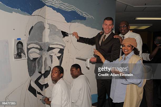 Tim McCormick and Bob Lanier, NBA Legends, lend a hand painting murals during the announcement of the Motor City Makeover Cleanup and Beautification...