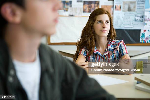 female high school student in class - redhead boy stock pictures, royalty-free photos & images