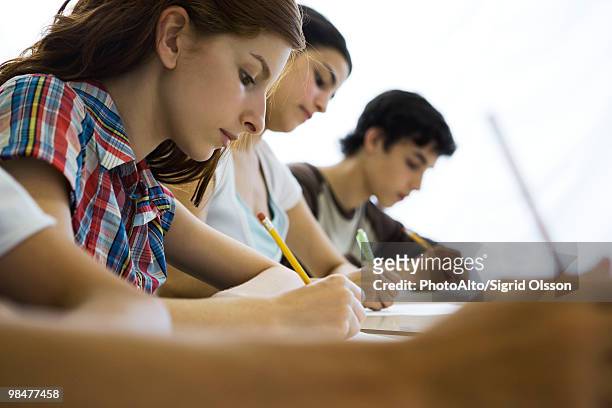 high school students concentrating in class - gymnasieexamen bildbanksfoton och bilder