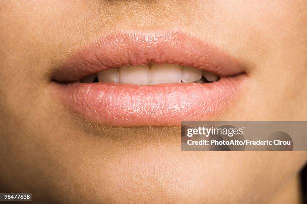 young woman's mouth, close-up - extreme close up mouth stock pictures, royalty-free photos & images