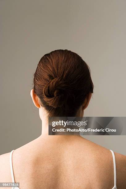 woman with hair arranged in chignon, rear view - kopf von hinten stock-fotos und bilder