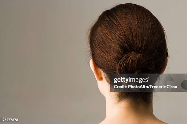 woman with hair arranged in chignon, rear view - back of head stockfoto's en -beelden