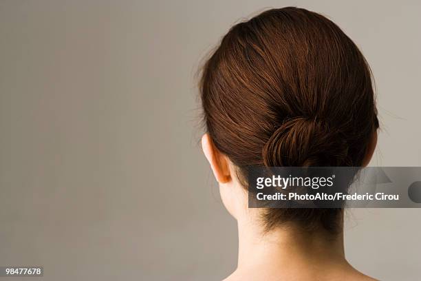 woman with hair arranged in chignon, rear view - 頭 個照片及圖片檔