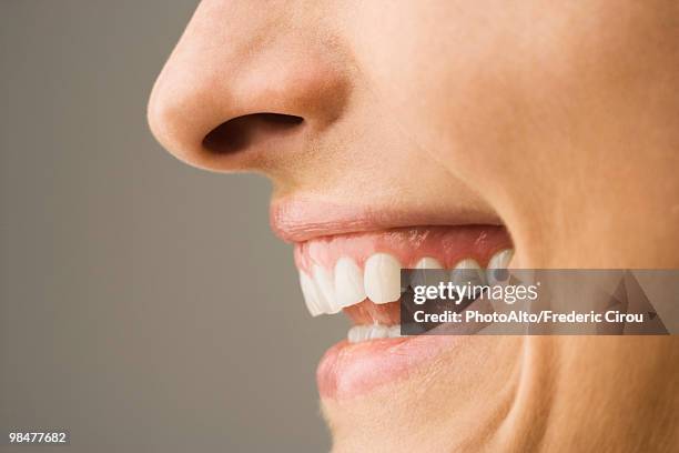 woman laughing, side view - human mouth stock pictures, royalty-free photos & images
