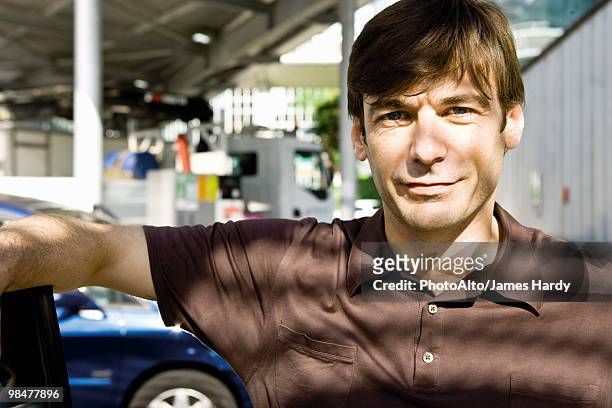 mid-adult man, portrait - gas station attendant stock pictures, royalty-free photos & images