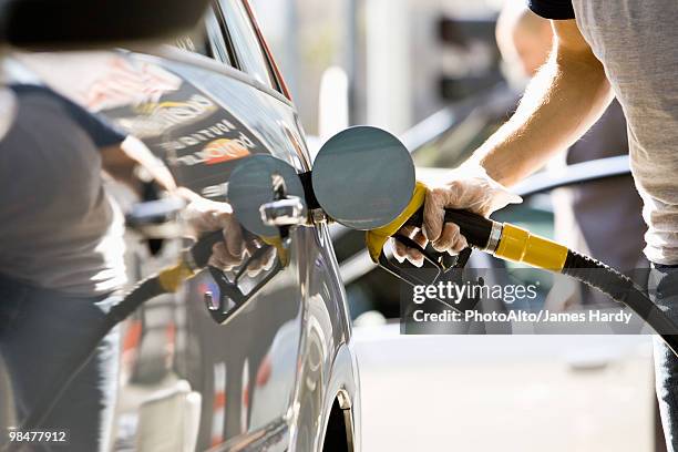 refueling vehicle at gas station - station service france stock pictures, royalty-free photos & images