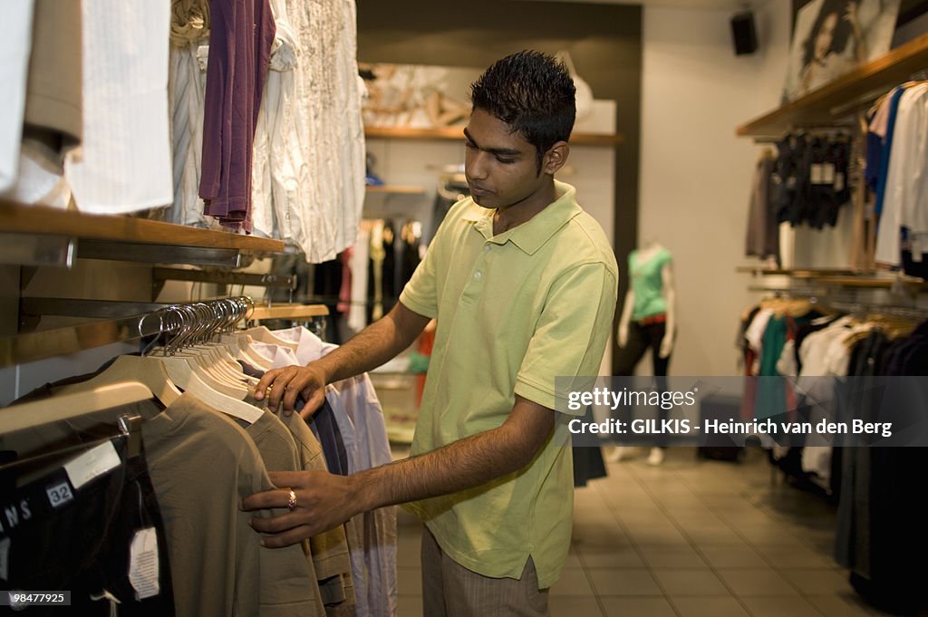 Man looking at clothes, KwaZulu Natal Province, South Africa