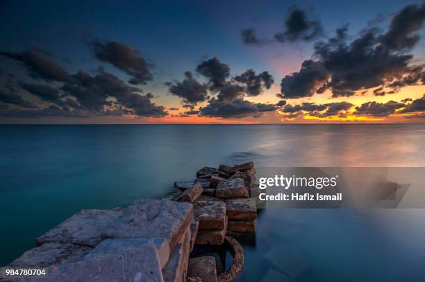 calm sunset at mabul island - mabul island stock pictures, royalty-free photos & images