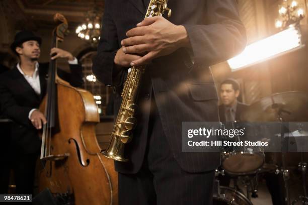 jazz musicians performing in nightclub - music band stock-fotos und bilder