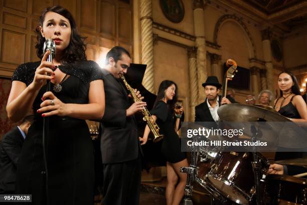 woman singing in nightclub - chic band stock pictures, royalty-free photos & images