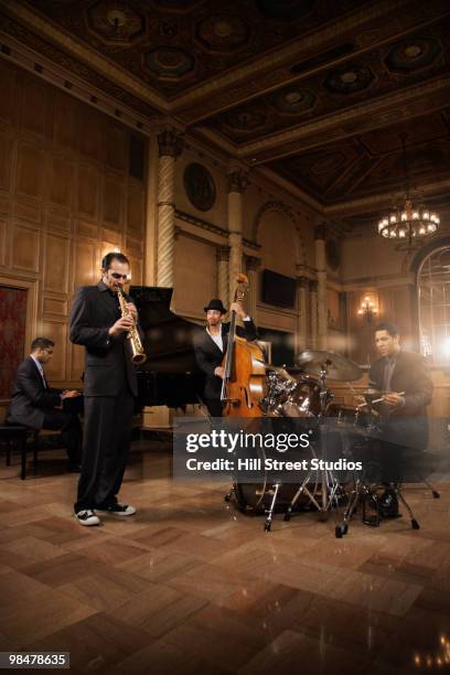 jazz musicians performing in nightclub - chic band stock pictures, royalty-free photos & images