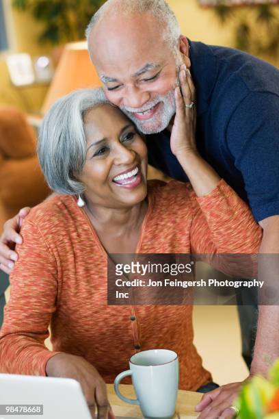 african american couple hugging - jon feingersh stock pictures, royalty-free photos & images