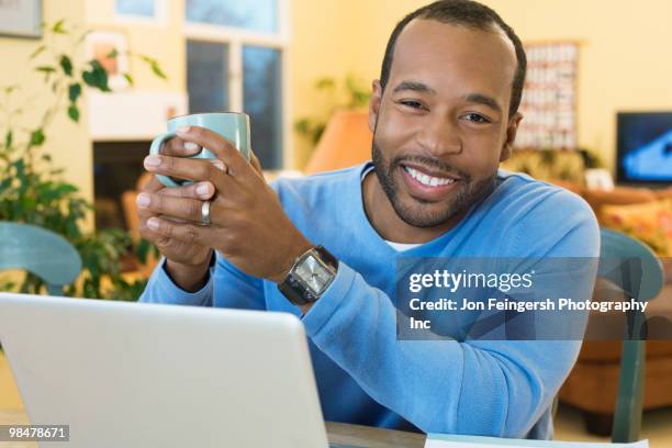 african american man drinking coffee - jon feingersh stock pictures, royalty-free photos & images