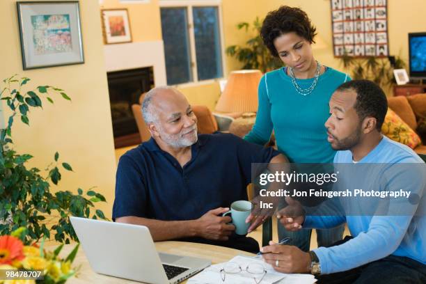 african american man with son and daughter talking - jon feingersh stock pictures, royalty-free photos & images