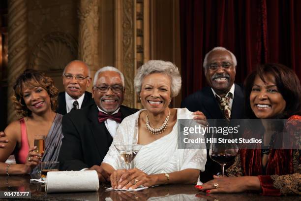 african american people drinking at bar - boomer couple out on town stock-fotos und bilder