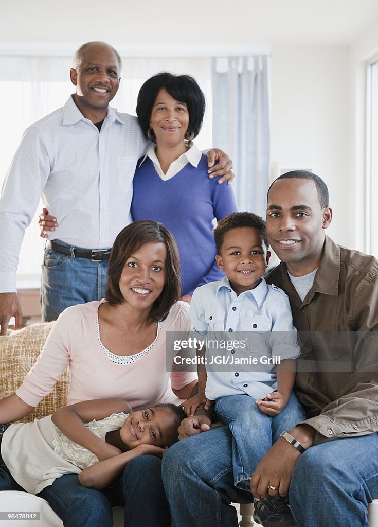 African American family sitting in living room