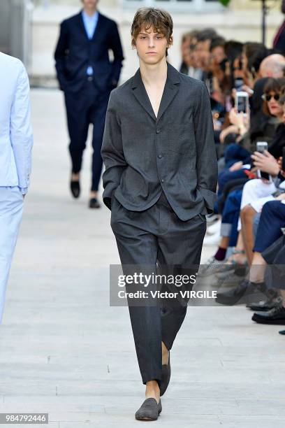 Model walks the runway during the Officine Generale Menswear Spring/Summer 2019 fashion show as part of Paris Fashion Week on June 24, 2018 in Paris,...