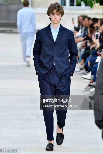 Model walks the runway during the Officine Generale Menswear Spring/Summer 2019 fashion show as part of Paris Fashion Week on June 24, 2018 in Paris,...