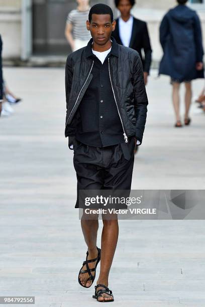 Model walks the runway during the Officine Generale Menswear Spring/Summer 2019 fashion show as part of Paris Fashion Week on June 24, 2018 in Paris,...