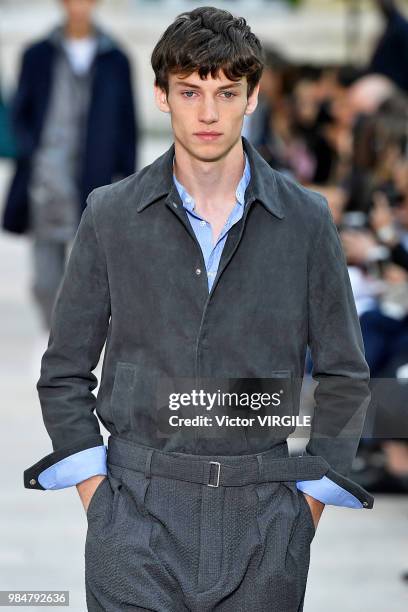 Model walks the runway during the Officine Generale Menswear Spring/Summer 2019 fashion show as part of Paris Fashion Week on June 24, 2018 in Paris,...