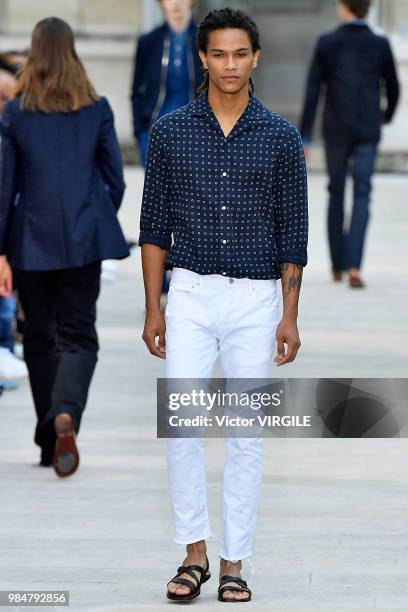 Model walks the runway during the Officine Generale Menswear Spring/Summer 2019 fashion show as part of Paris Fashion Week on June 24, 2018 in Paris,...