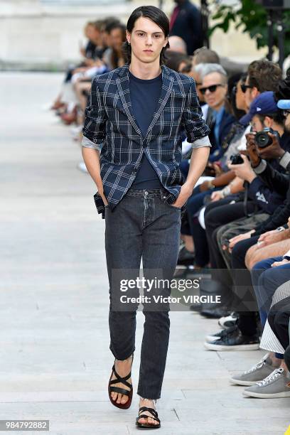 Model walks the runway during the Officine Generale Menswear Spring/Summer 2019 fashion show as part of Paris Fashion Week on June 24, 2018 in Paris,...