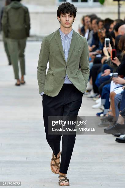 Model walks the runway during the Officine Generale Menswear Spring/Summer 2019 fashion show as part of Paris Fashion Week on June 24, 2018 in Paris,...