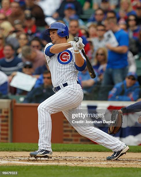 Ryan Theriot of the Chicago Cubs takes a swing against the Milwaukee Brewers on Opening Day at Wrigley Field on April 12, 2010 in Chicago, Illinois....