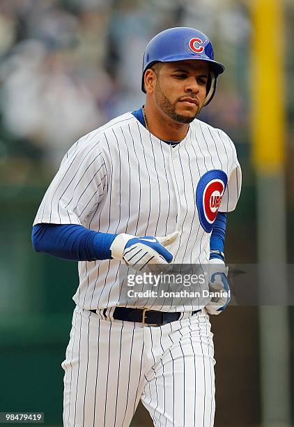 Aramis Ramirez of the Chicago Cubs runs the bases after his fourth inning home run against the Milwaukee Brewers on Opening Day at Wrigley Field on...