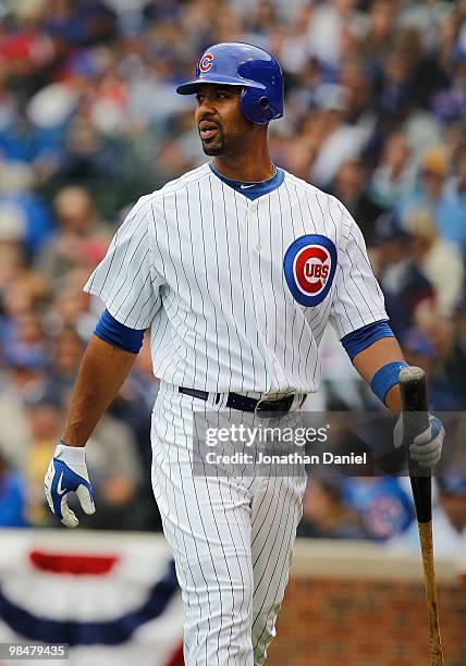 Derrek Lee of the Chicago Cubs walks back to the dugout after striking out against the Milwaukee Brewers on Opening Day at Wrigley Field on April 12,...