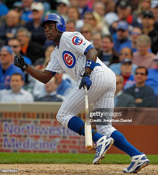 Alfonso Soriano of the Chicago Cubs runs after hitting the the ball against the Milwaukee Brewers on Opening Day at Wrigley Field on April 12, 2010...