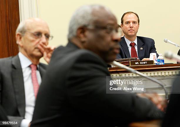 Supreme Court Justices Clarence Thomas and Stephen Breyer testify as Rep. Adam Schiff looks on during a hearing before the Financial Services and...