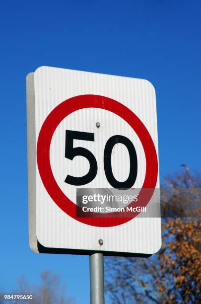 50 kilometres per hour speed limit sign - speed limit sign stock pictures, royalty-free photos & images