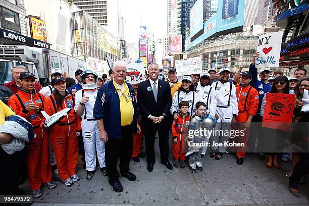 President, Intrepid Sea, Air & Space Museum Bill White and Space Shuttle supporters pose for a photo in Times Square to show support for bringing a...