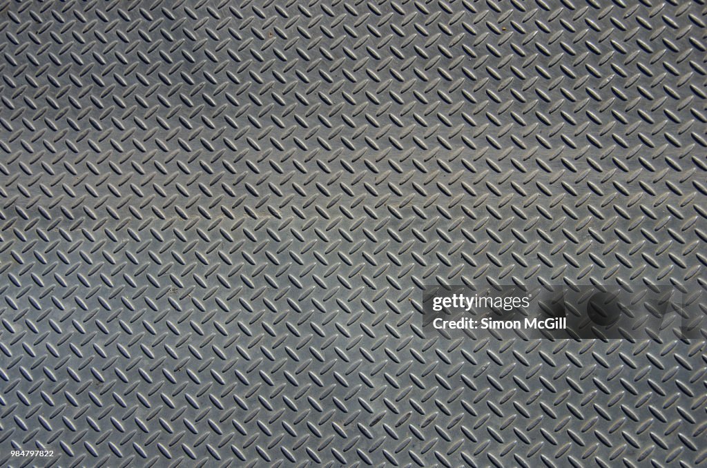 Stainless steel metal plate flooring with crosshatch non-slip texture