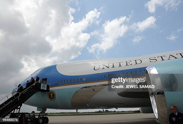 President Barack Obama disembarks Air Force One as he arrives to tour a commercial rocket processing facility at Cape Canaveral Air Force Station in...