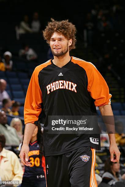 Robin Lopez of the Phoenix Suns looks on with a smile during the game against the Golden State Warriors at Oracle Arena on March 22, 2010 in Oakland,...