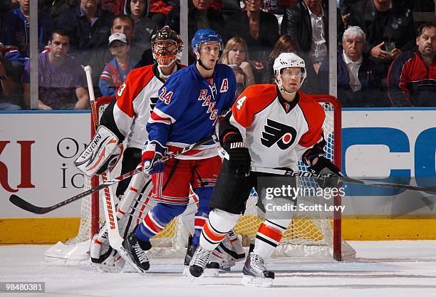 Kimmo Timonen and goaltender Brian Boucher of the Philadelphia Flyers protect the net against Ryan Callahan of the New York Rangers on April 9, 2010...