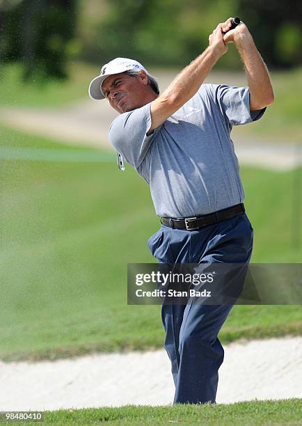 Fred Couples hits to the 18th green during the Red Stag Challenge presented by Jim Beam for the Outback Steakhouse Pro-Am at TPC Tampa Bay on April...