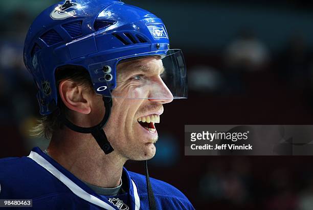 Mikael Samuelsson of the Vancouver Canucks looks on from the bench during their game against the Calgary Flames at General Motors Place on April 10,...