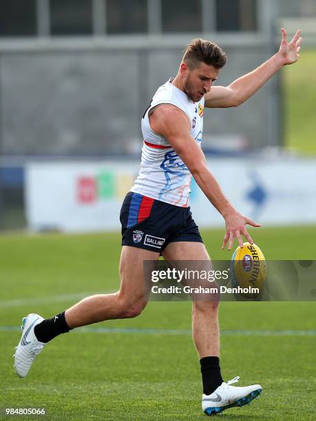 Marcus Bontempelli of the Bulldogs kicks during a training session at Whitten Oval on June 27, 2018 in Melbourne, Australia.