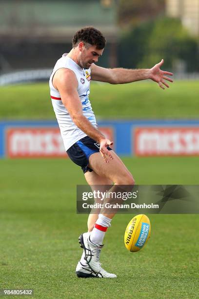 Kieran Collins of the Bulldogs kicks during a training session at Whitten Oval on June 27, 2018 in Melbourne, Australia.