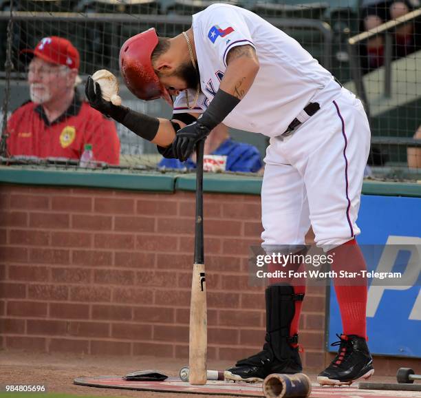 Texas Rangers second baseman Rougned Odor puts some rosin bag on his batting helmet during the first inning against the San Diego Padres at Globe...