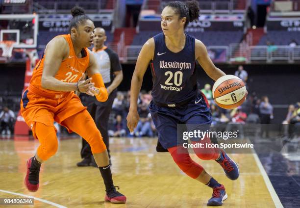 Washington Mystics guard Kristi Toliver dribbles past Connecticut Sun guard Alex Bentley during a WNBA game between the Washington Mystics and the...