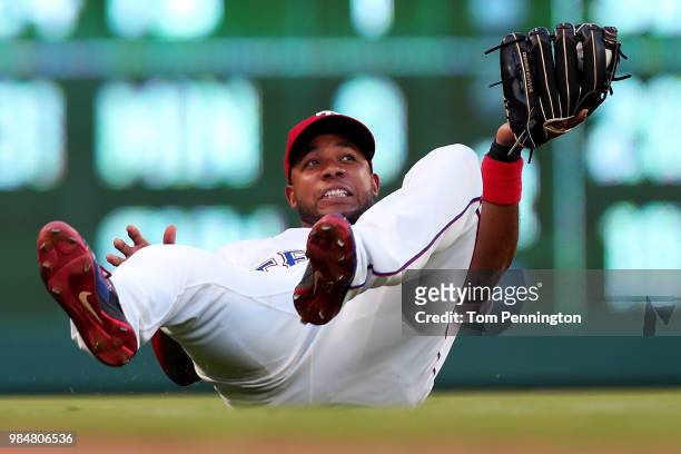 Elvis Andrus of the Texas Rangers fields a popup for the out against the San Diego Padres in the top of the fourth inning at Globe Life Park in...