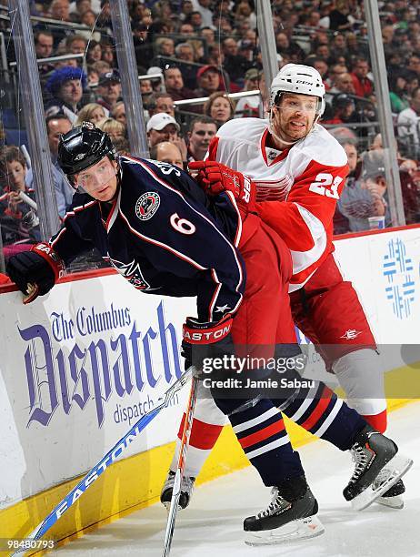 Defensemen Anton Stralman of the Columbus Blue Jackets and Brad Stuart of the Detroit Red Wings battle for a loose puck on April 9, 2010 at...