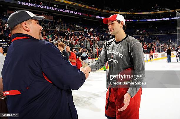 Defenseman Fedor Tyutin of the Columbus Blue Jackets thanks a fan for his support on April 9, 2010 at Nationwide Arena in Columbus, Ohio. Detroit...