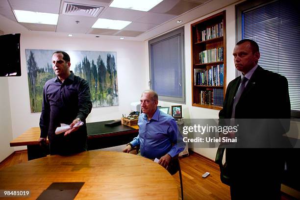 Former Israeli Prime Minister Ehud Olmert poses for photographers after delivering a public statement at his office on April 15, 2010 in Tel Aviv,...
